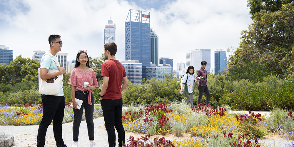 A group of international students standing in front of the BHP building in Perth
