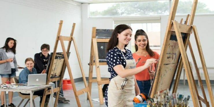Students painting in the fine art studio